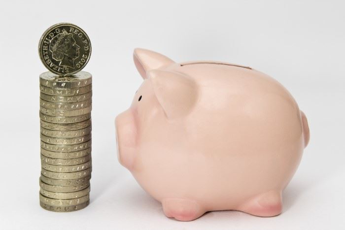 Coin stack and piggy bank